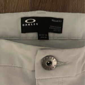 Oakley golf pants, silver, size 38, 5 pocket including stash pocket.